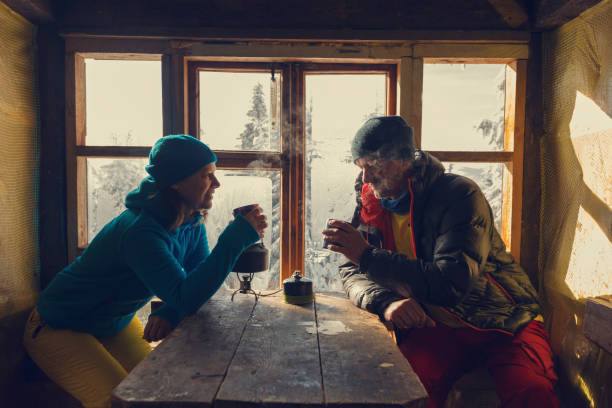Happy couple of travelers is drinking coffee stock photo