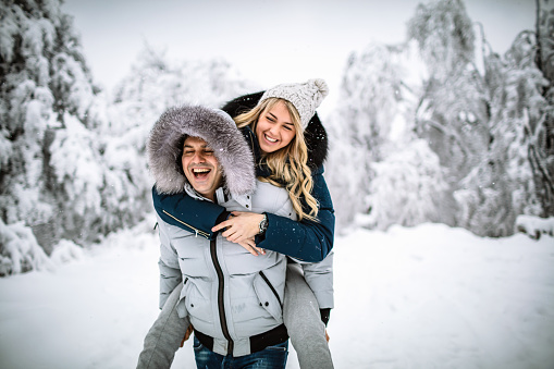 Photo of happy couple on a snowy day