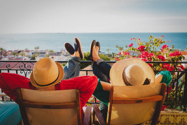 happy couple relax on balcony terrace, relax happy couple relax on balcony terrace, family vacation costa blanca stock pictures, royalty-free photos & images