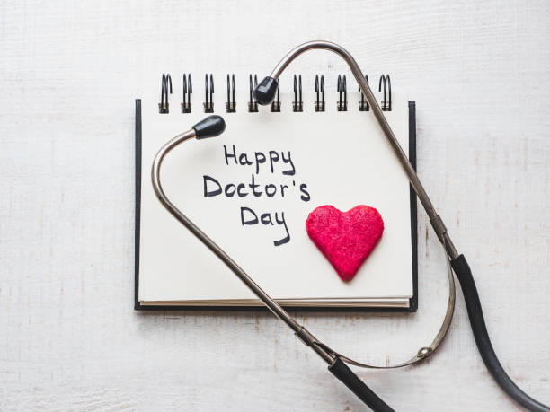 행복 한 의사의 하루입니다. 아름 다운 인사말 카드입니다. 격리 된 배경 - 날 뉴스 사진 이미지