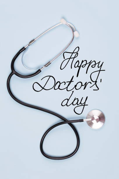 Happy Doctors' Day Stethoscope and text Happy Doctors' Day on blue background happy doctors day stock pictures, royalty-free photos & images