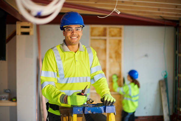happy electrician on site stock photo