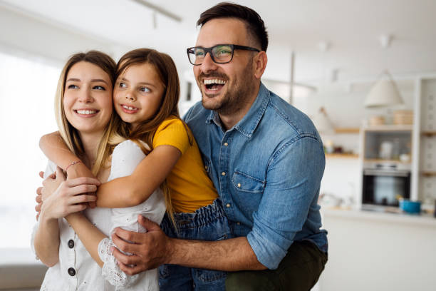Happy family having fun time at home stock photo
