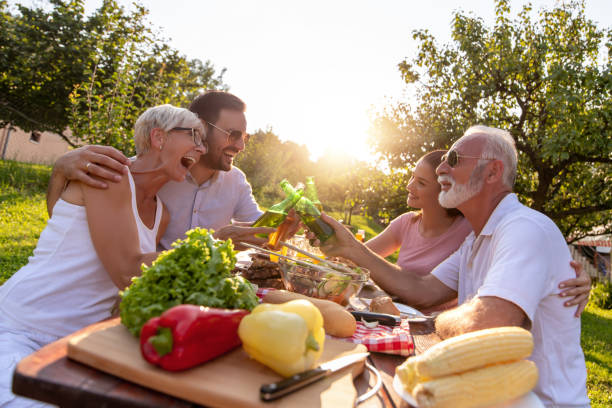 Happy family having lunch at summer garden party stock photo