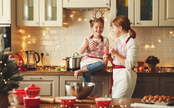 happy family mother and child bake christmas cookies happy funny mother and child  daughter bake christmas cookies baking photos stock pictures, royalty-free photos & images