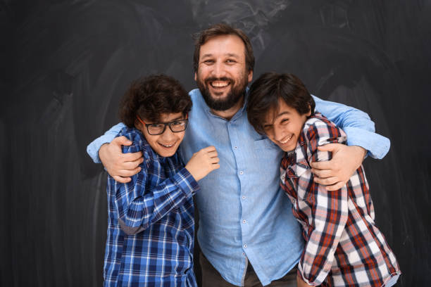 happy father hugging sons unforgetable moments of family joy in mixed race middle eastern arab family stock photo