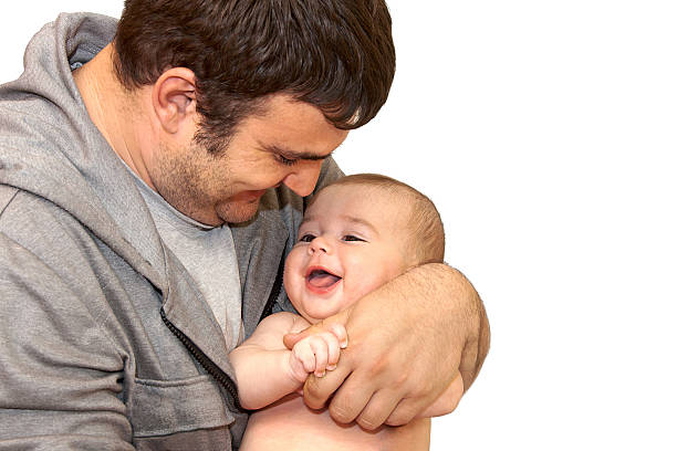 Happy father playing with his ​​little son stock photo