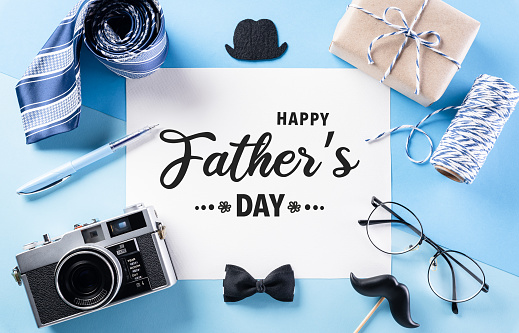 Happy Father's Day decoration concept with greeting card on pastel blue background.