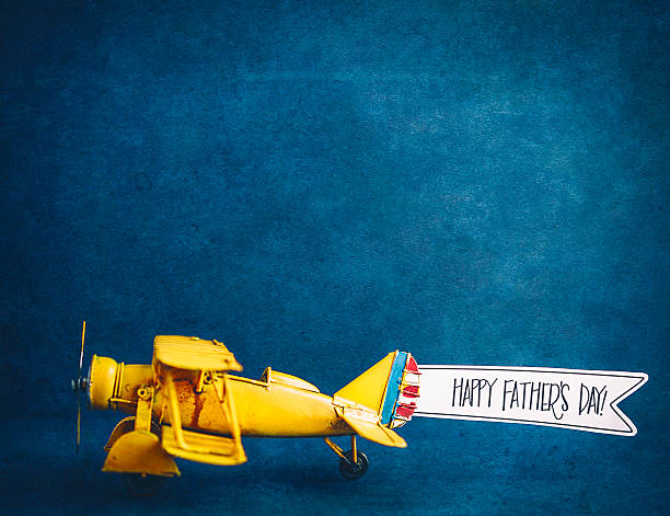 Happy Father's Day! Vintage airplane with handmade banner Happy Father's Day! Vintage airplane with handmade banner fathers day stock pictures, royalty-free photos & images