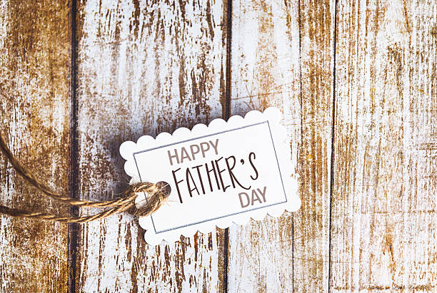 Happy Father's Day wish on gift tag with copy space Happy Father's Day wish on gift tag with copy space fathers day stock pictures, royalty-free photos & images