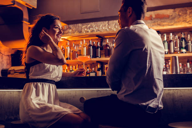 Happy girlfriend feeling relaxed spending time with her man Happy girlfriend. Happy girlfriend wearing white dress feeling relaxed spending time with her man flirting stock pictures, royalty-free photos & images