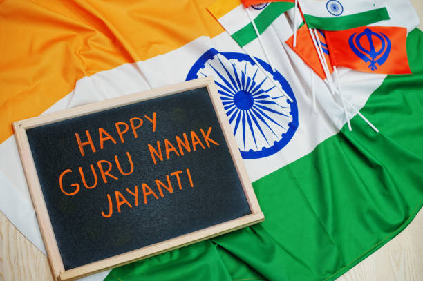 Happy Guru Nanak Jayanti theme. Board with flags. Happy Guru Nanak Jayanti theme. Board with flags. guru nanak stock pictures, royalty-free photos & images