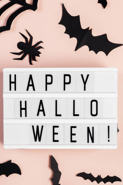 Happy Halloween. Bats on pink pastel background. stock photo