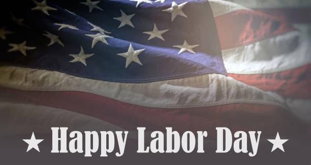 Happy Labor Day text on USA Flag background. America holiday celebration stock photo