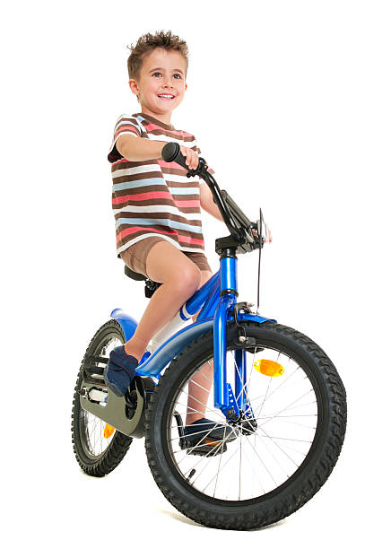 Happy little boy on bike stock photo