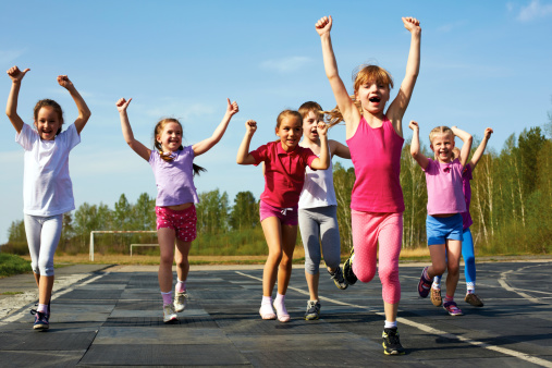 Group of children running on the treadmill at the stadium