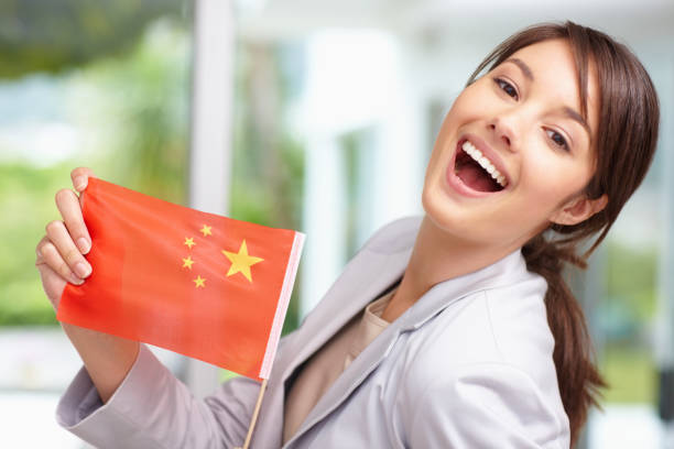 Happy lovely woman with a Chinese flag