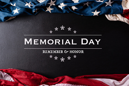 Happy Memorial Day. American flags with the text REMEMBER & HONOR against a black  background. May 25.