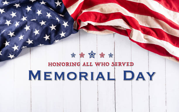 Happy memorial day concept made from american flag with text over white wooden background. stock photo