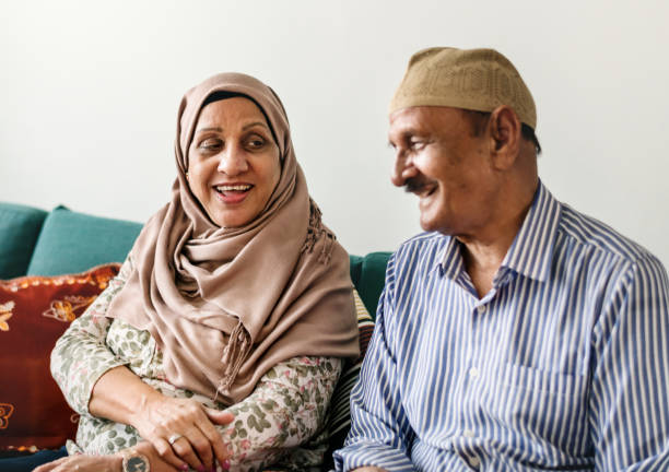 Happy Middle Eastern mature couple at home Happy Middle Eastern mature couple at home old arab man stock pictures, royalty-free photos & images