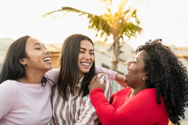 Happy multiracial friends having fun in the city - Young people lifestyle concept Happy multiracial friends having fun in the city - Young people lifestyle concept columbian woman stock pictures, royalty-free photos & images