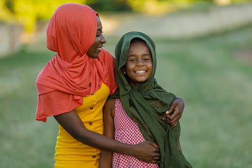 A Woman of Muslim Ethnicity and her Lovely Daughter With Hijabs Spending a Wonderful Time in Nature and Showing Lovely Emotions.