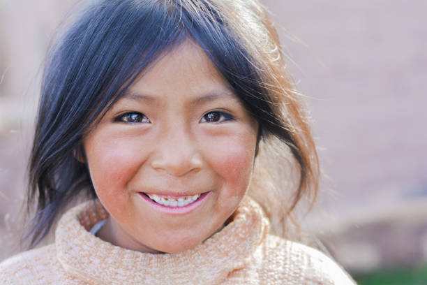 Happy native american kid outdoor. Pretty little girl smiling happily outside. peru girl stock pictures, royalty-free photos & images