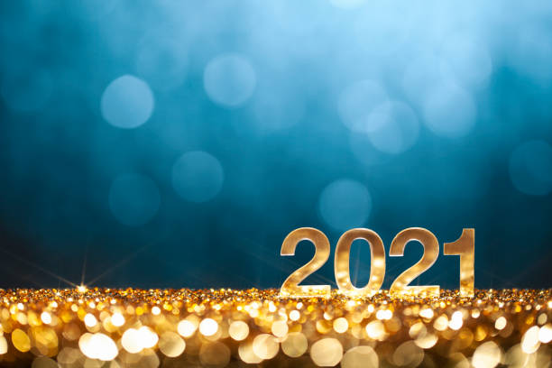 Happy New Year 2021 - Christmas Gold Blue Glitter Golden numbers 2021 on glitter and defocused lights. happy new year 2021 stock pictures, royalty-free photos & images