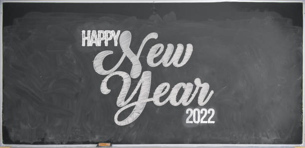 Happy New Year 2022 in chalk and blackboard stock photo