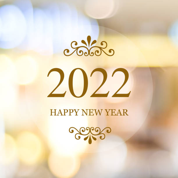 Happy New Year 2022 on blur abstract bokeh background, new year greeting card, banner stock photo