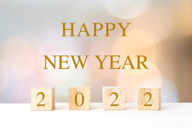 Happy New Year 2022 on blur abstract bokeh background, new year greeting card, banner stock photo
