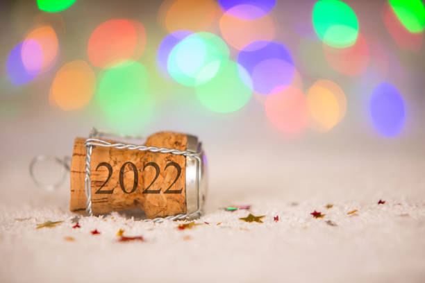 Happy New Year 2022 with Star Shape and Cork on the Snow stock photo