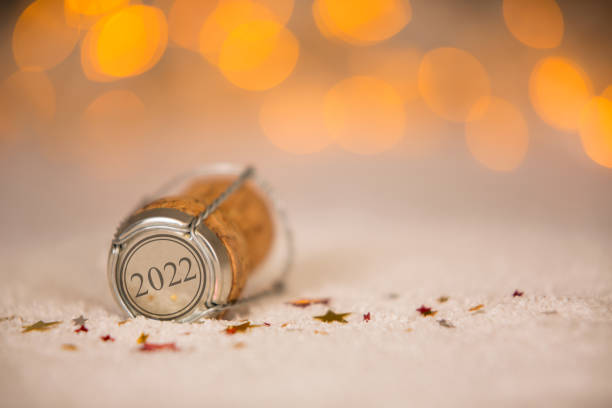 Happy New Year 2022 with Star Shape and Cork on the Snow stock photo