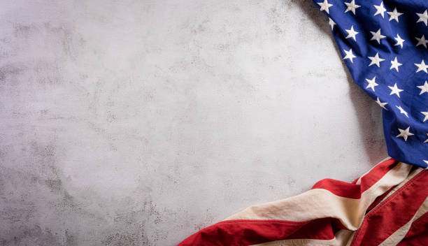 Happy presidents day concept with flag of the United States on old stone background. stock photo