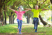 istock Happy senior couple exercising in the park 1352773070