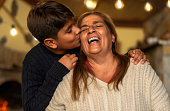 istock Happy smiling Hispanic grandmother and his grandchild having tender moment together - Family love and unity concept 1355995757
