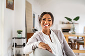 istock Happy smiling mid woman relaxing at home 1319763796