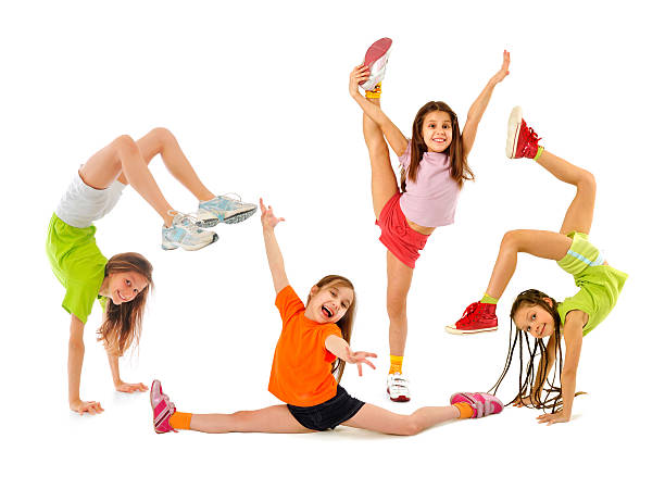 Happy sporty children Little girls gymnasts doing exercises doing the splits stock pictures, royalty-free photos & images