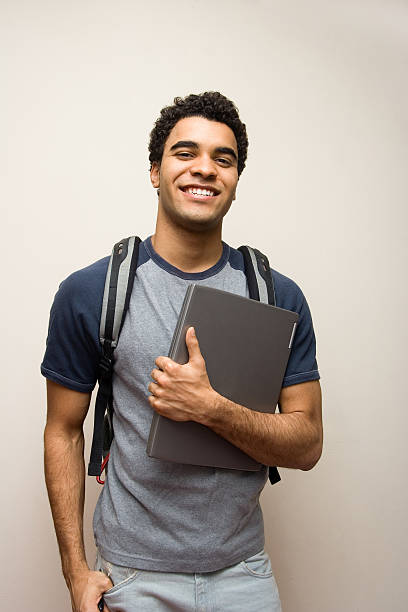 Happy student with laptop stock photo