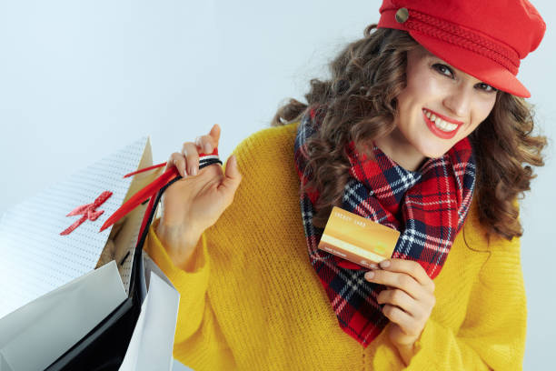 happy stylish woman shopper showing golden credit card  personalized gift card stock pictures, royalty-free photos & images
