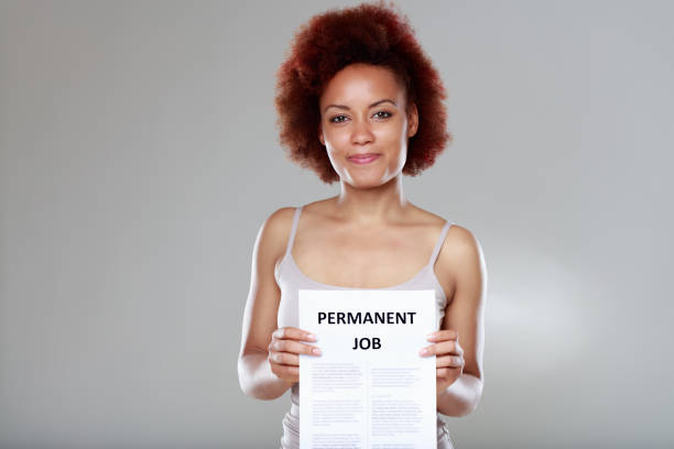 Happy sucessful young Black woman appointed to a job stock photo