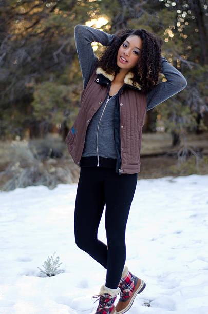 Happy teen in winter wardrobe stock photo