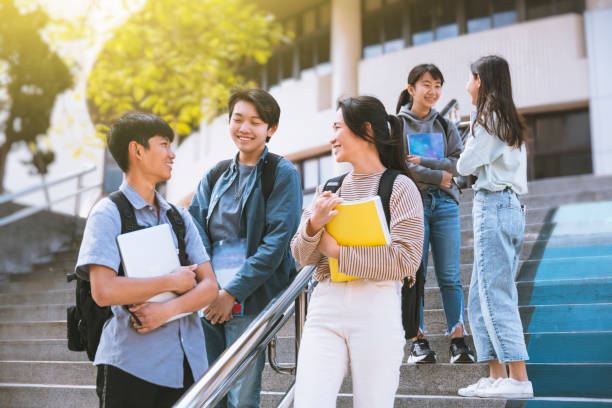 Happy Teenager Students talking and Walking On Stairs Happy Teenager Students talking and Walking On Stairs asian students stock pictures, royalty-free photos & images