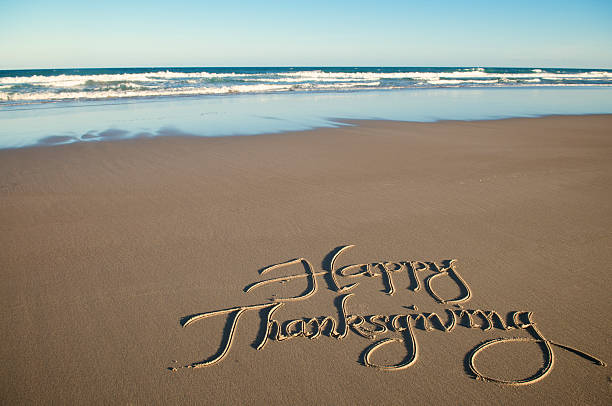Happy Thanksgiving Calligraphy Message in Sand stock photo