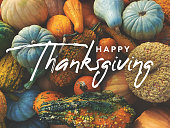 istock Happy Thanksgiving Holiday Greeting Card Handwritten Calligraphy Text Design with Fall Pumpkins, Squash and Gourds Colorful Background 1344603597