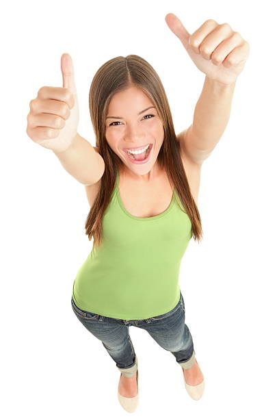 Happy woman giving thumbs up stock photo