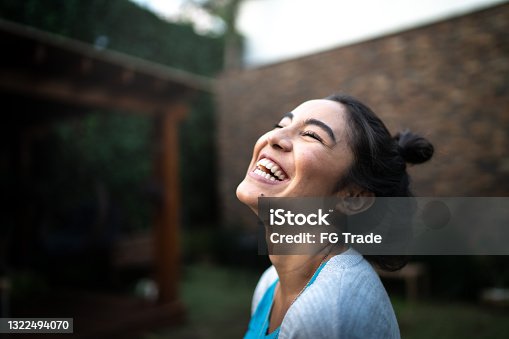 istock Happy woman inhaling at home 1322494070