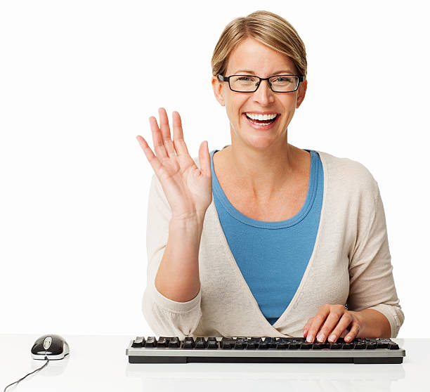 Happy Woman Waving While Chatting Online stock photo