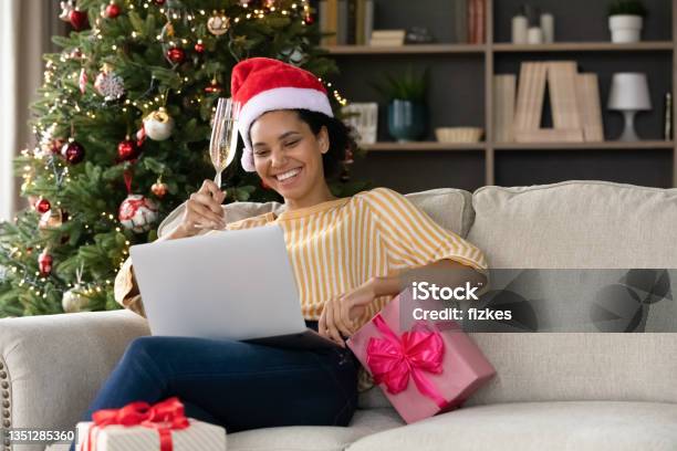 Happy young african american woman congratulating with holidays online.