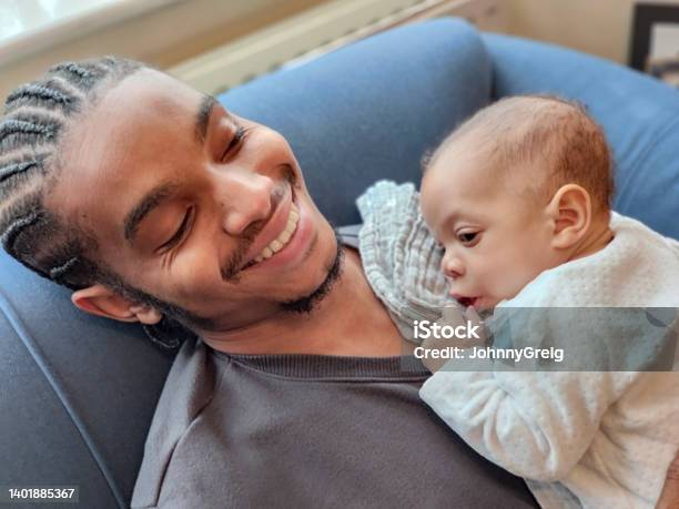 Happy young father with baby daughter